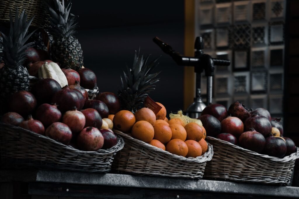 A colorful display of fruit baskets representing Importance of fruits in diet